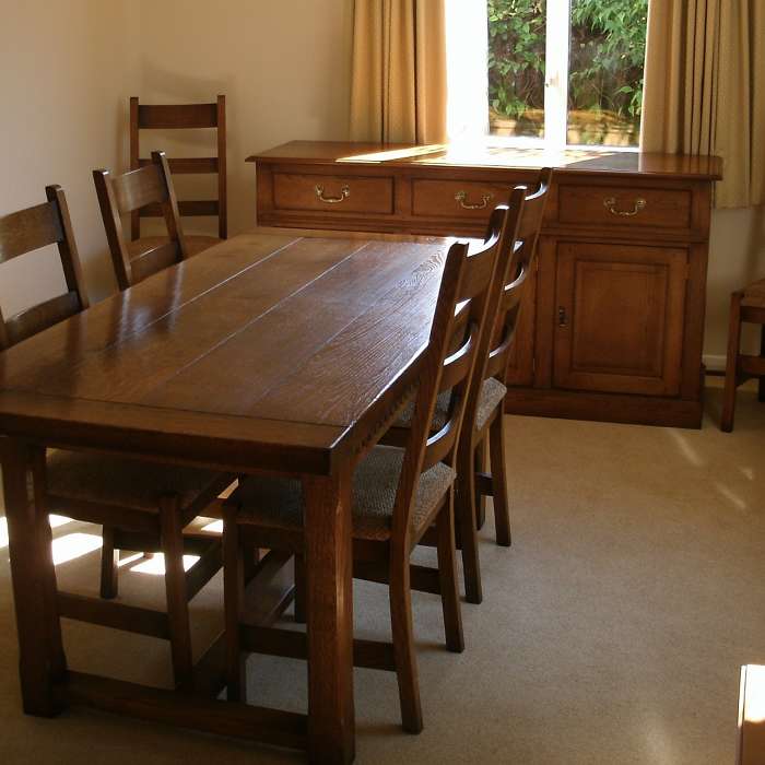 Chamfer Table with Contemporary Chairs and matching sideboard