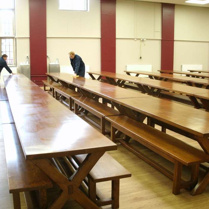 Nine rows of four tables and benches
