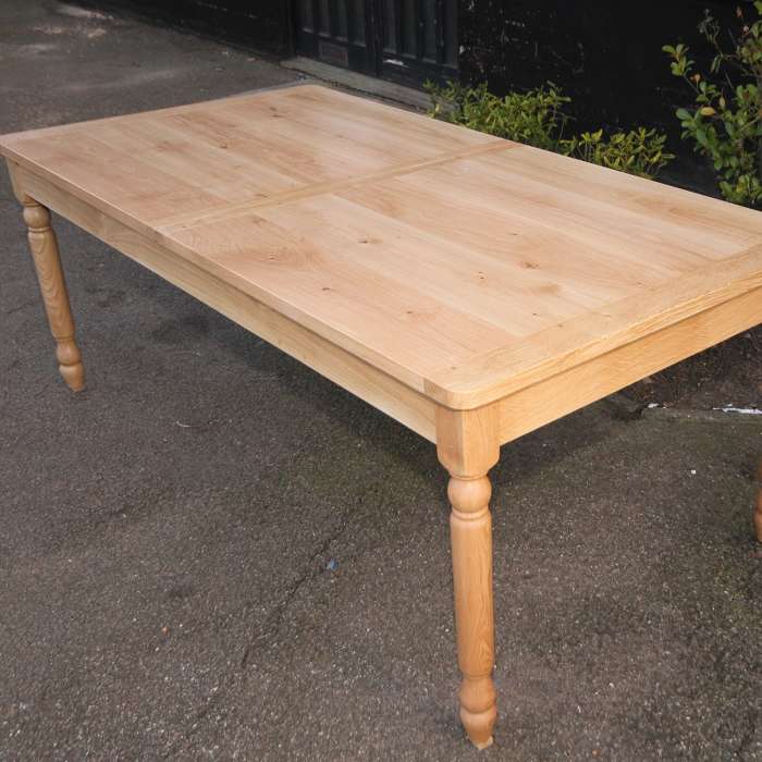 Turned leg dining table in natural wax finish
