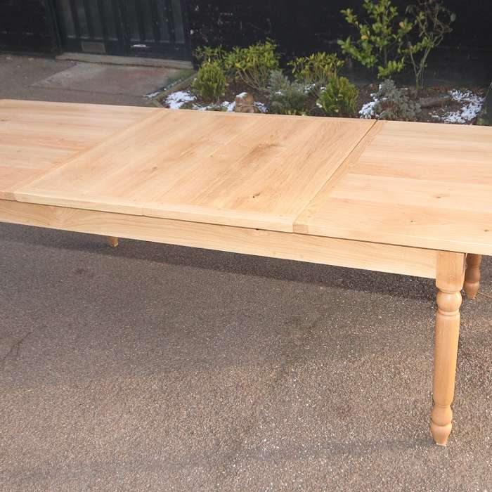 Natural wax finish oak table with extending leaves