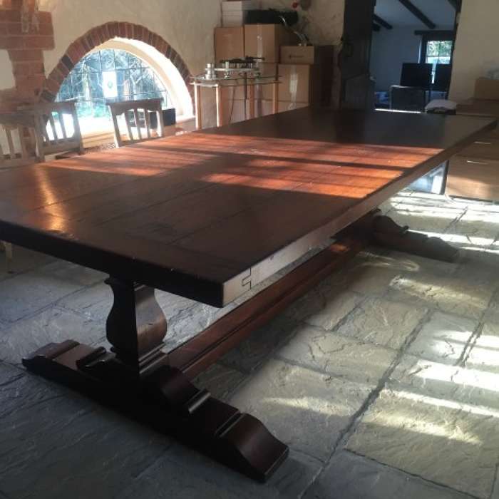 A large square column oak refectory table with an extra think top